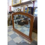 A hardwood overmantel mirror