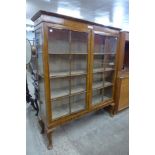 A George I style walnut two door bookcase