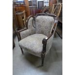 A n Edward VII carved mahogany and fabric upholstered tub chair