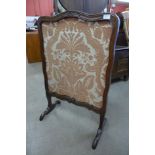 An 18th Century French carved walnut fire screen