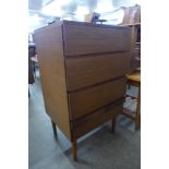 A teak chest of drawers