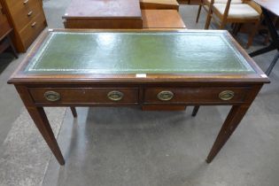 An Edward VII inlaid mahogany and green leather topped two drawer writing table
