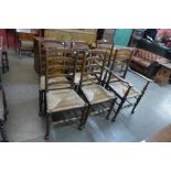 A set of six George III style elm rush seated ladderback chairs