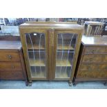 A carved oak two door bookcase