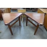 A pair of teak triangular side tables