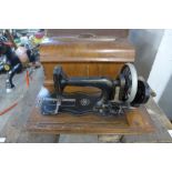 A Victorian inlaid walnut cased sewing machine