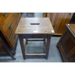 An oak laboratory stool