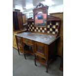 A late Victorian carved walnut and marble topped washstand