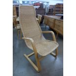 A Swedish beech bentwood and wicker cantilever armchair