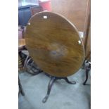 A George III mahogany circular tilt-top tripod tea table