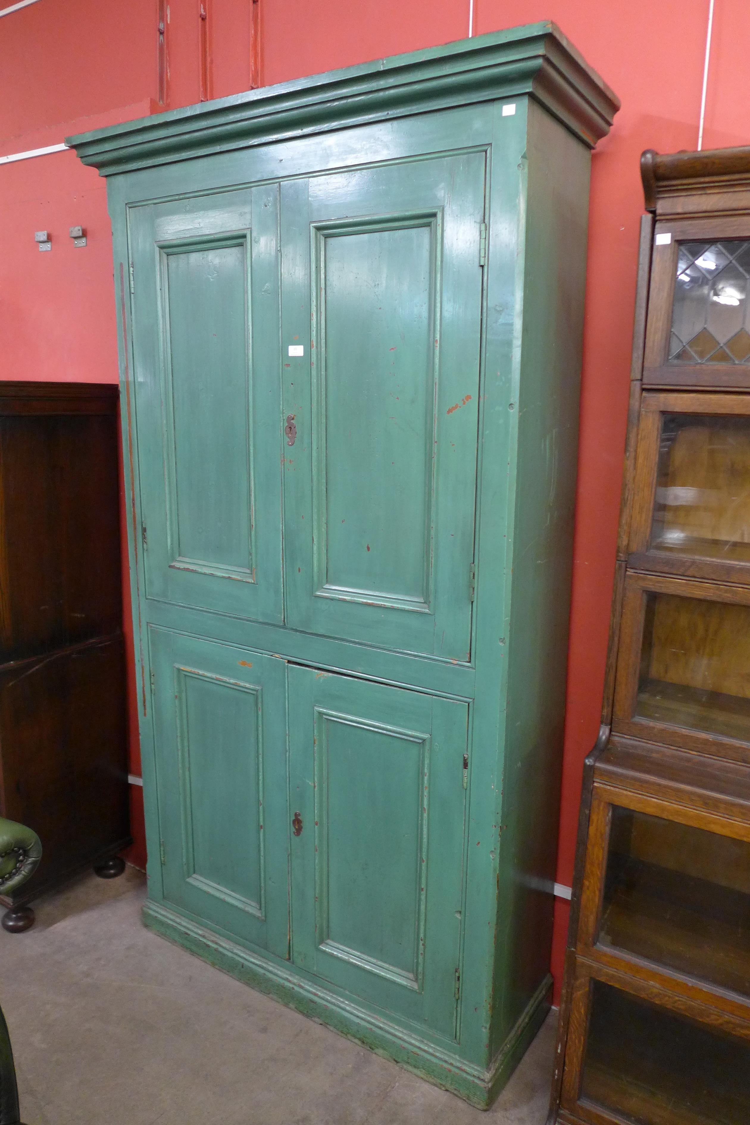 A Victorian painted pine four door housekeeper's cupboard