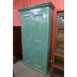 A Victorian painted pine four door housekeeper's cupboard