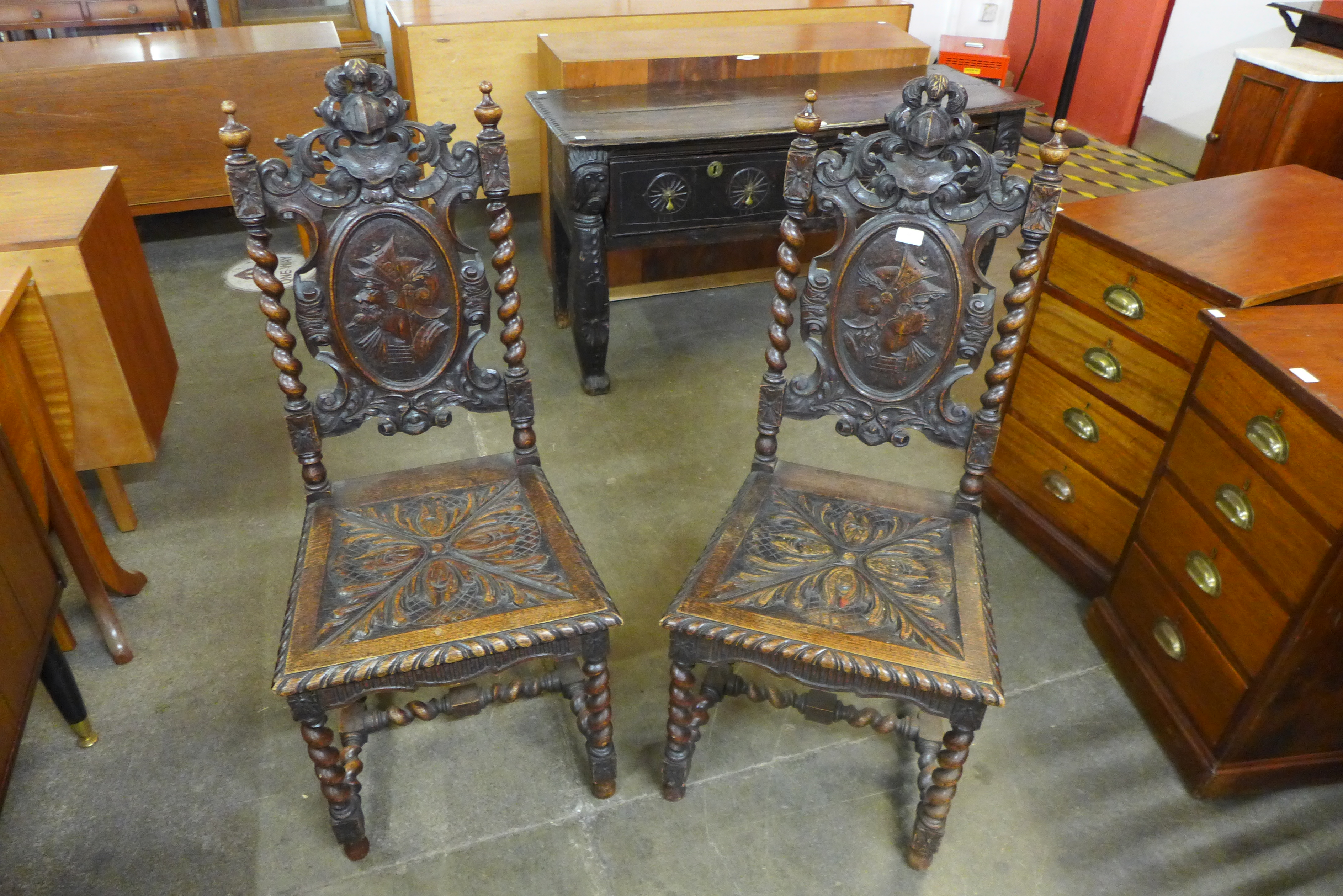 A pair of 19th Century Flemish carved oak side chairs