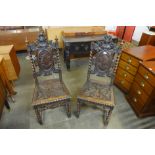 A pair of 19th Century Flemish carved oak side chairs