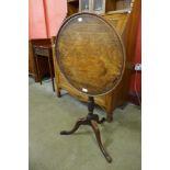 A George III mahogany circular tilt top tripod table