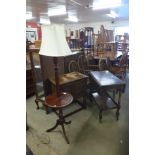 An oak trolley, a carved oak credence cupboard and a mahogany standard lamp