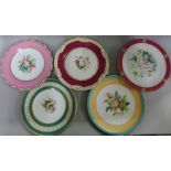 Twelve hand painted cabinet plates each with floral decoration to the centre