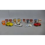 Toy petrol pumps and plastic cars plus two Corgi Toys vehicles