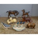 A collection of Beswick animals comprising two horses, two dogs, cats, ducks and a bird, some a/f