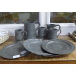 Five pewter tankards and four pewter plates