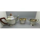 A silver three piece tea service, Birmingham 1936, 861g, retailed by Harrods