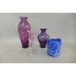 Three items of Caithness glass comprising two amethyst vases and a candlestick and a marbled slag