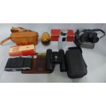 Two pairs of binoculars, a camera, a razor and a key ring