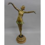 A 1920's Art Deco painted spelter figure of a girl on an onyx base, 33.5cm, right hand a/f