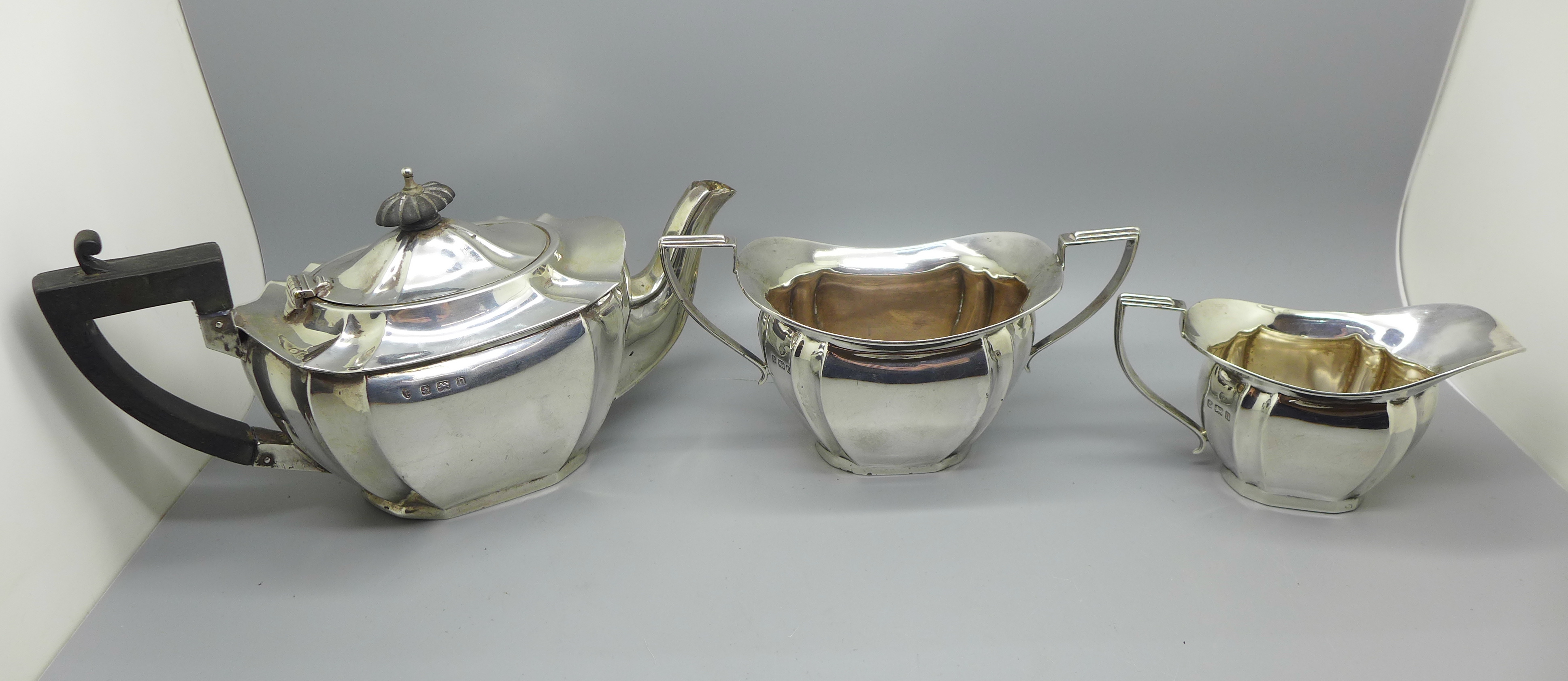 A silver three piece bachelors tea service, Birmingham 1912, 422g