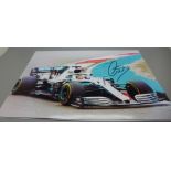 Two signed colour photographs of Lewis Hamilton