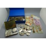 A collection of coins and banknotes