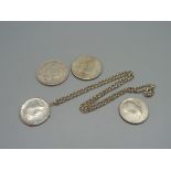 Two U.S. dollars, 1922 and 1923, and two U.S. half dollars, one with mount and silver chain