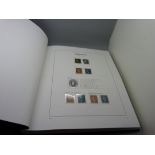 A Stanley Gibbons album volume 1, 1840-1970 of Great Britain stamps with pre-printed pages,