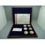 Six coin collection "Britannia Through The Ages" in wooden case, with certificate no.000863