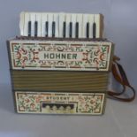 A Hohner Student 1 accordion, keys a/f