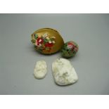 Two Oriental carved pendants and a decorated 'egg'