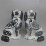 A pair of early 20th Century Staffordshire spaniels, 27.5cm