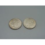 Two U.S. one dollar coins, 1900 and 1921