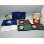 A 1987 US silver dollar, cased, a British Legion commemorative medallion, cased, a Churchill