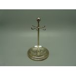 A silver jewellery stand, 10cm