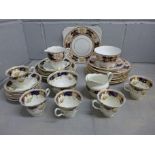 A Warwick Heathcote tea service including five cups and seven saucers and one other part tea service