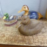 A carved wooden duck by Randy Tull, signed, 'World Champion Carver', Dallas, TX, and two others