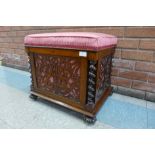 A Victorian rosewood fretwork music stool