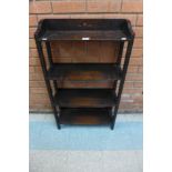 A small Arts and Crafts oak open bookcase