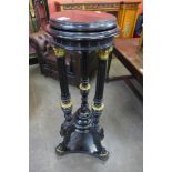 A 19th Century French ebonised and parcel gilt pedestal