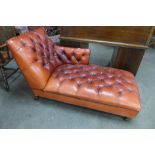 A Chesterfield red leather chaise longue