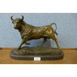 A French style bronze figure of a bull, on black marble plinth