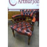 A beech and ox blood leather desk chair