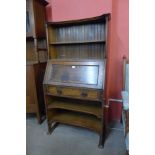 An Arts and Crafts oak bureau bookcase