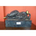 A Surrealist style bronze figure of a reclining female nude